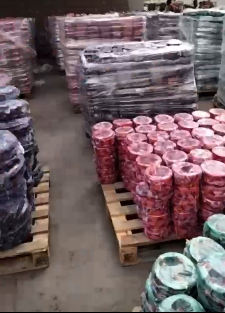 Red wiring cable coils on pallets, ready for delivery