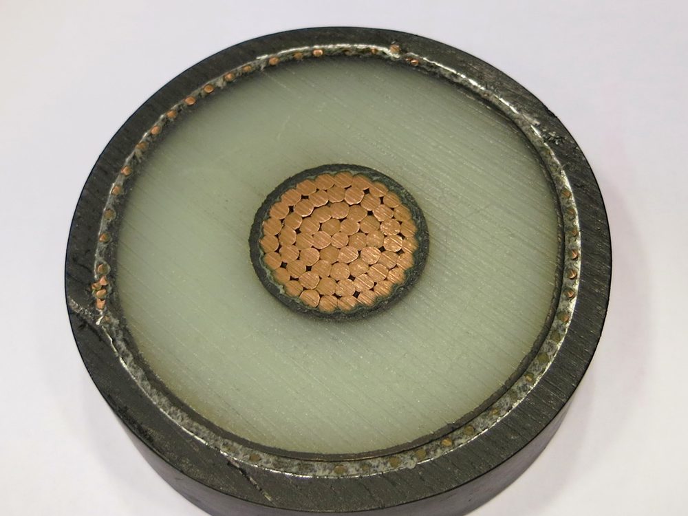 Cross section of a heavy power cable showing the copper conductor and insulation