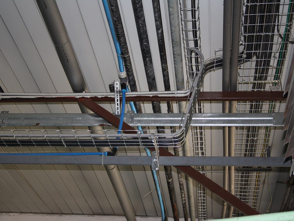 Cable trays and trunking carrying cables overhead